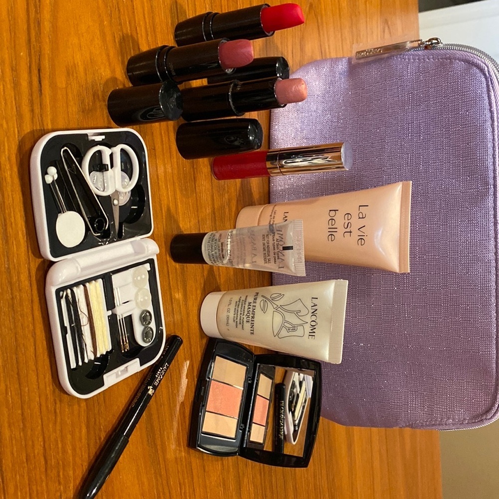 Lancôme cosmetic bag with makeup and Rick Steves travel sewing kit